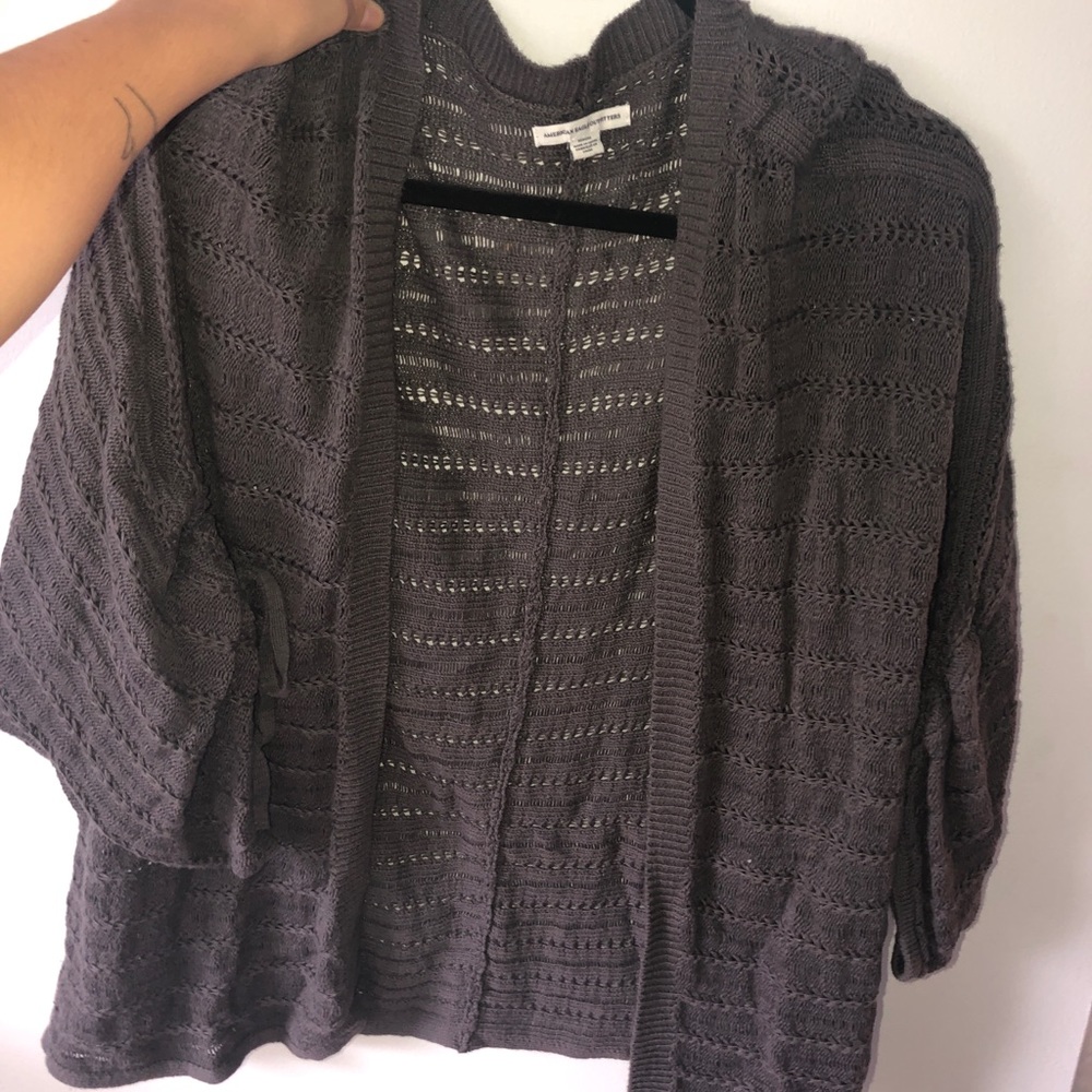 Gray cardigan. 3/4 sleeve, ties at the end.